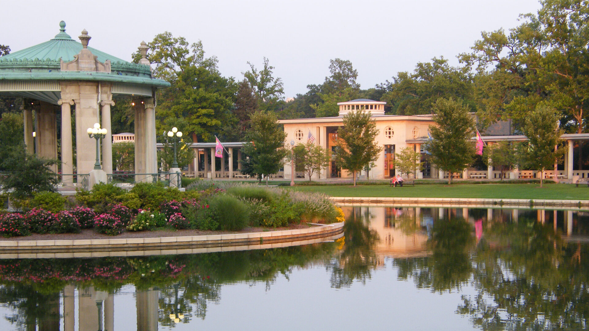 A photo of The Muny from the front of the building, featuring lake parallaz and the gazebo in Forest Park. Second Century Campaign.