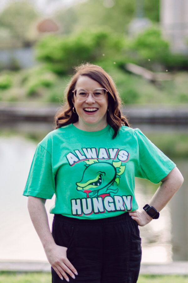 Woman posing in Little Shop of Horrors t-shirt