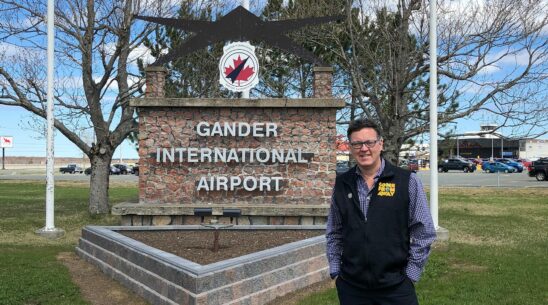 Kevin Tuerff stands in front of Gander International Airport