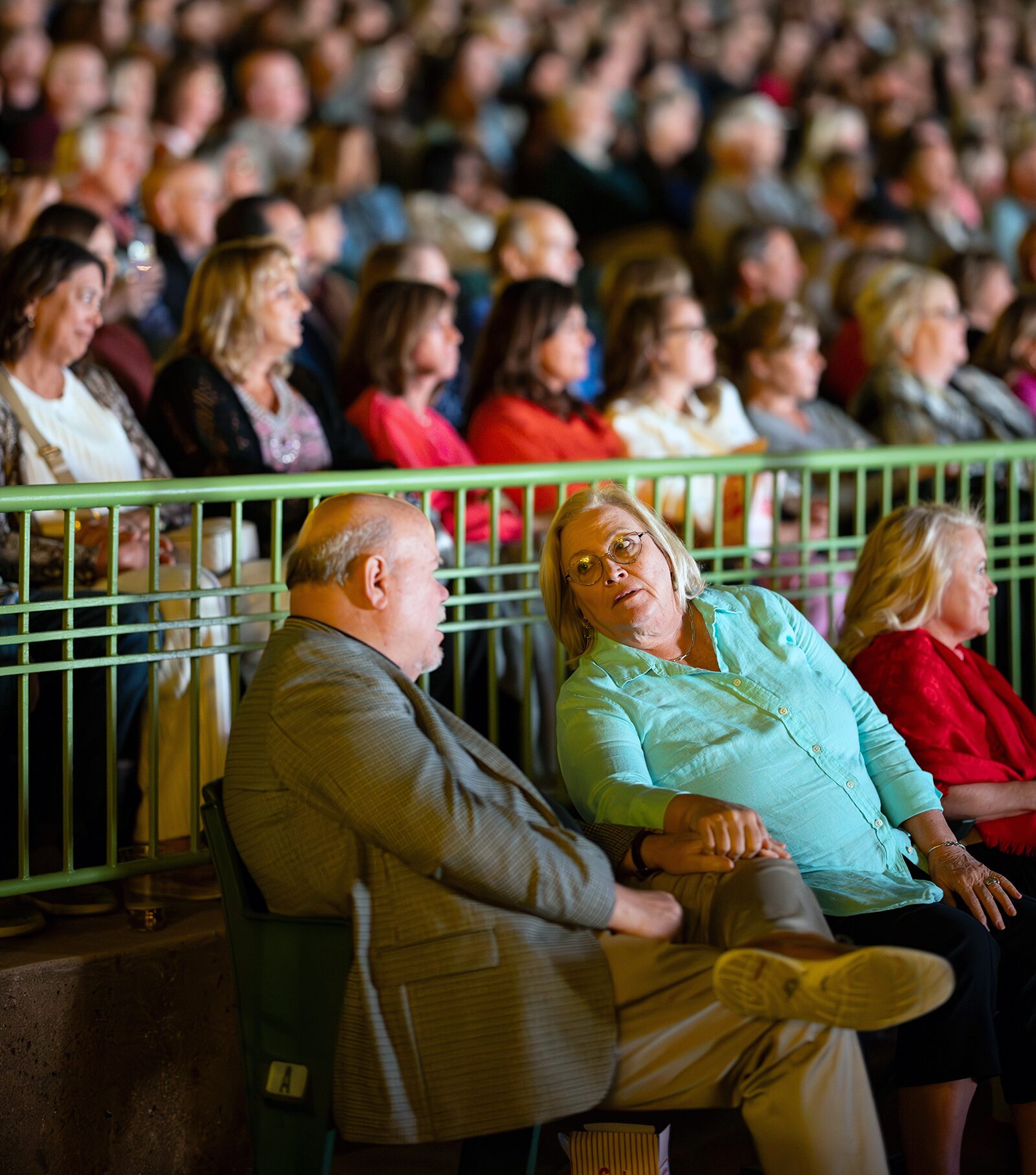 Muny patrons sit in fold-away companion seats during a performance