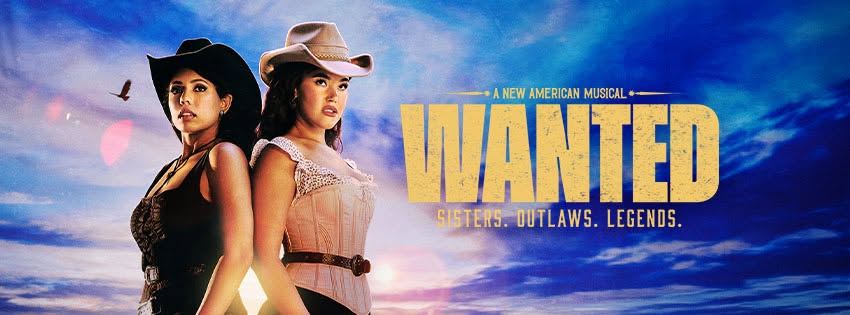 Promotional poster for the musical Wanted: Sisters. Outlaws. Legends. featuring two women in cowboy hats standing against a cloudy sky.
